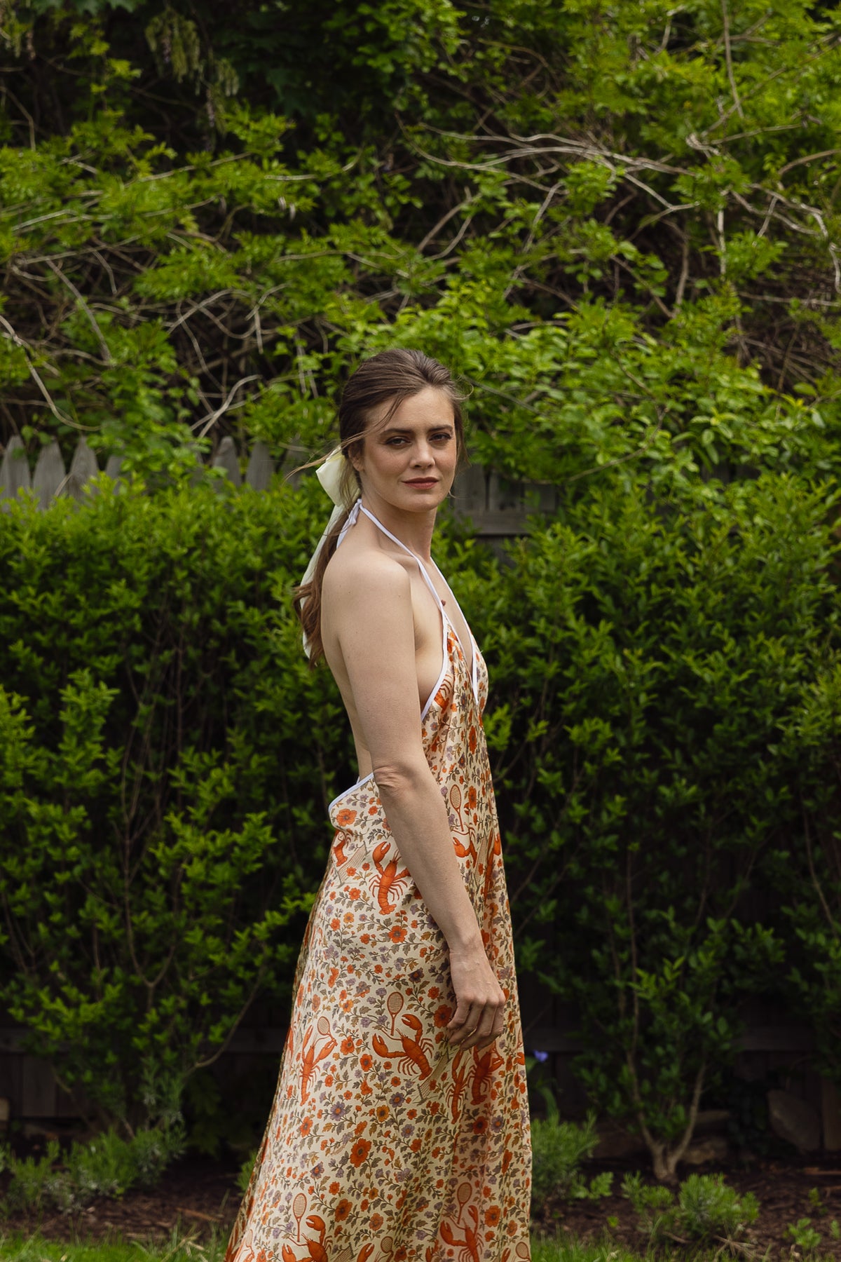 The Lobster Serve Dress in 100% silk with a tennis print, front view