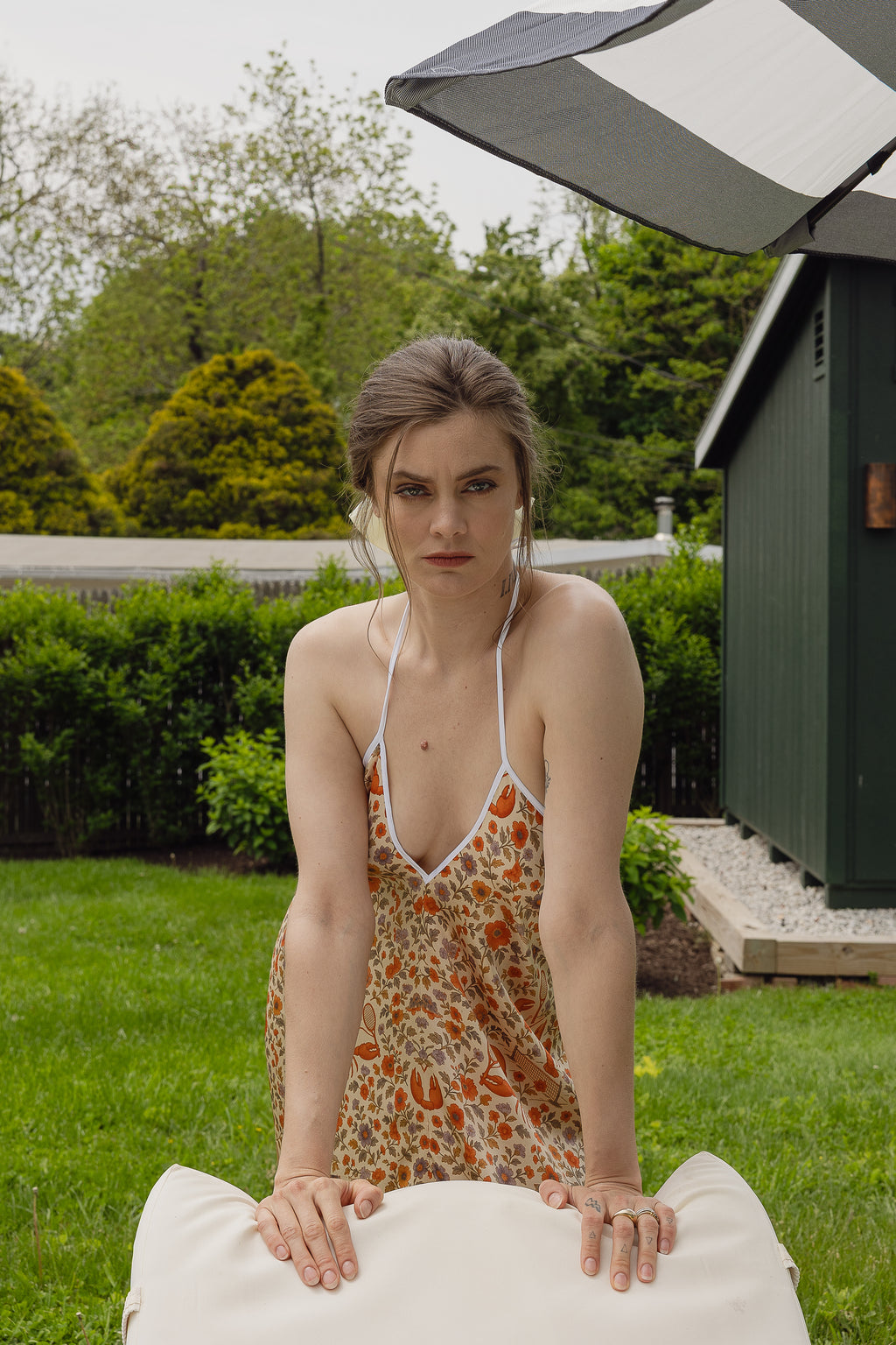 The Lobster Serve Dress in 100% silk with a tennis print, back view