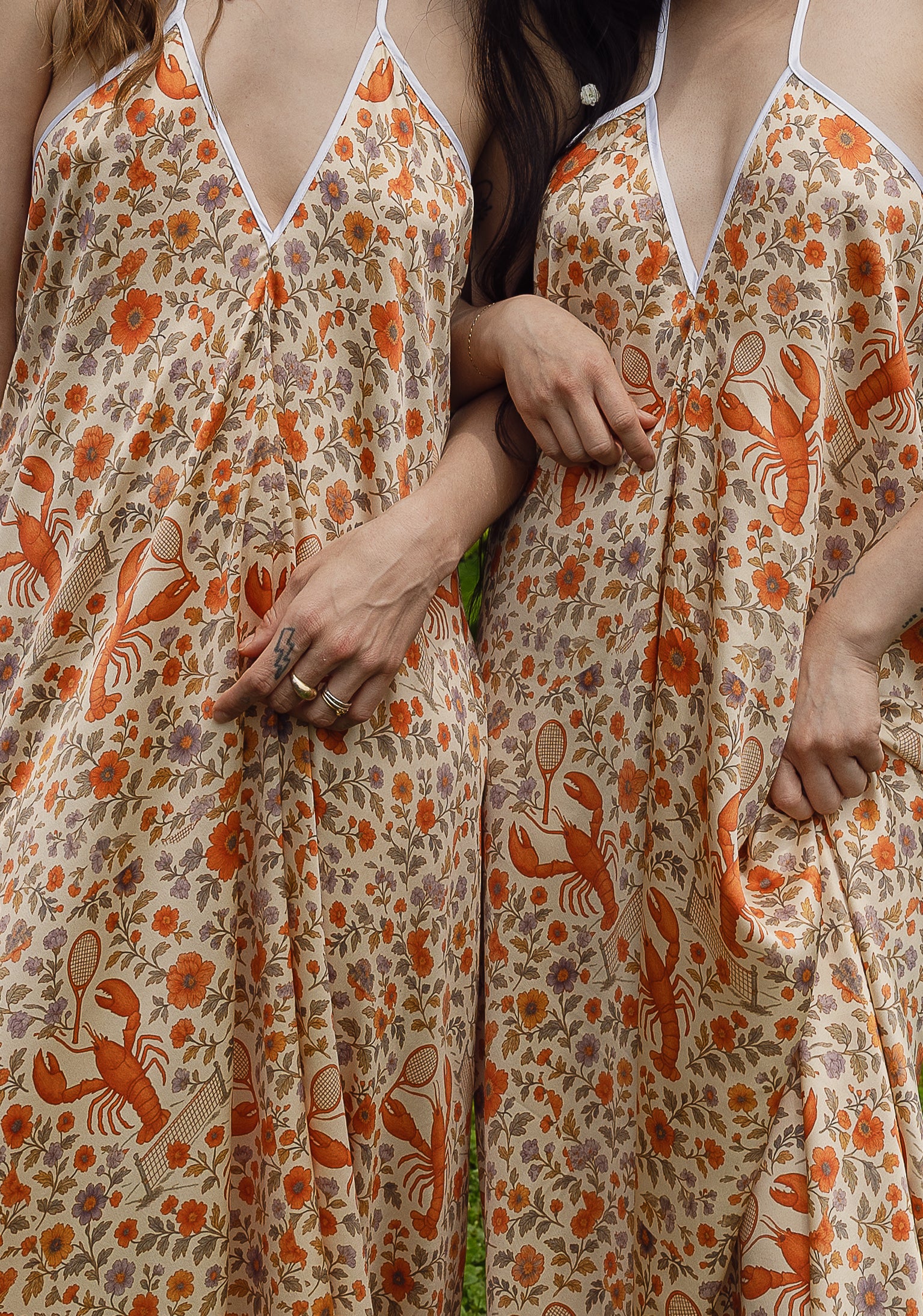 The Lobster Serve Dress in 100% silk with a tennis print, styled shot