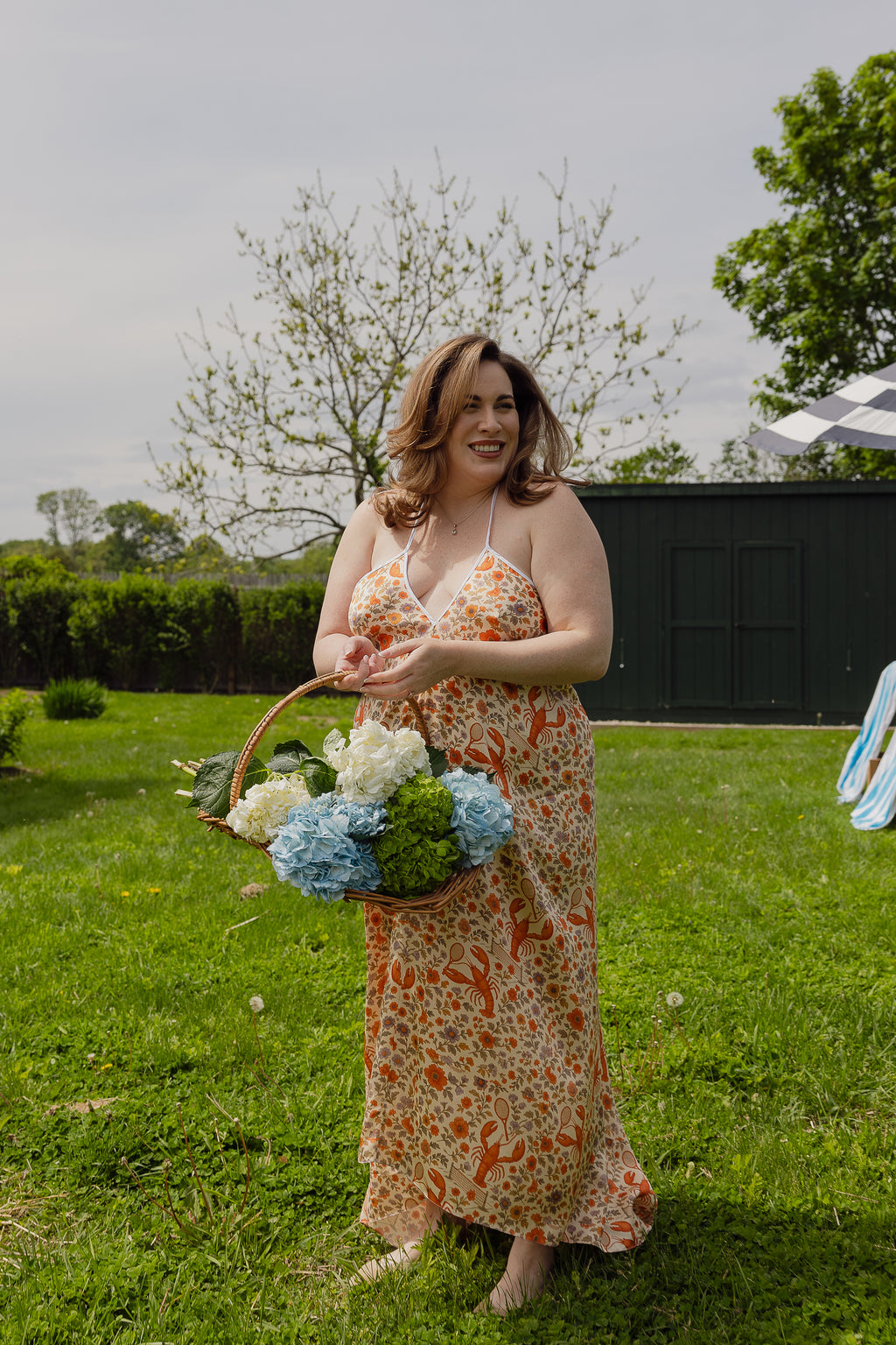 The Lobster Serve Dress in 100% silk with a tennis print, side profile