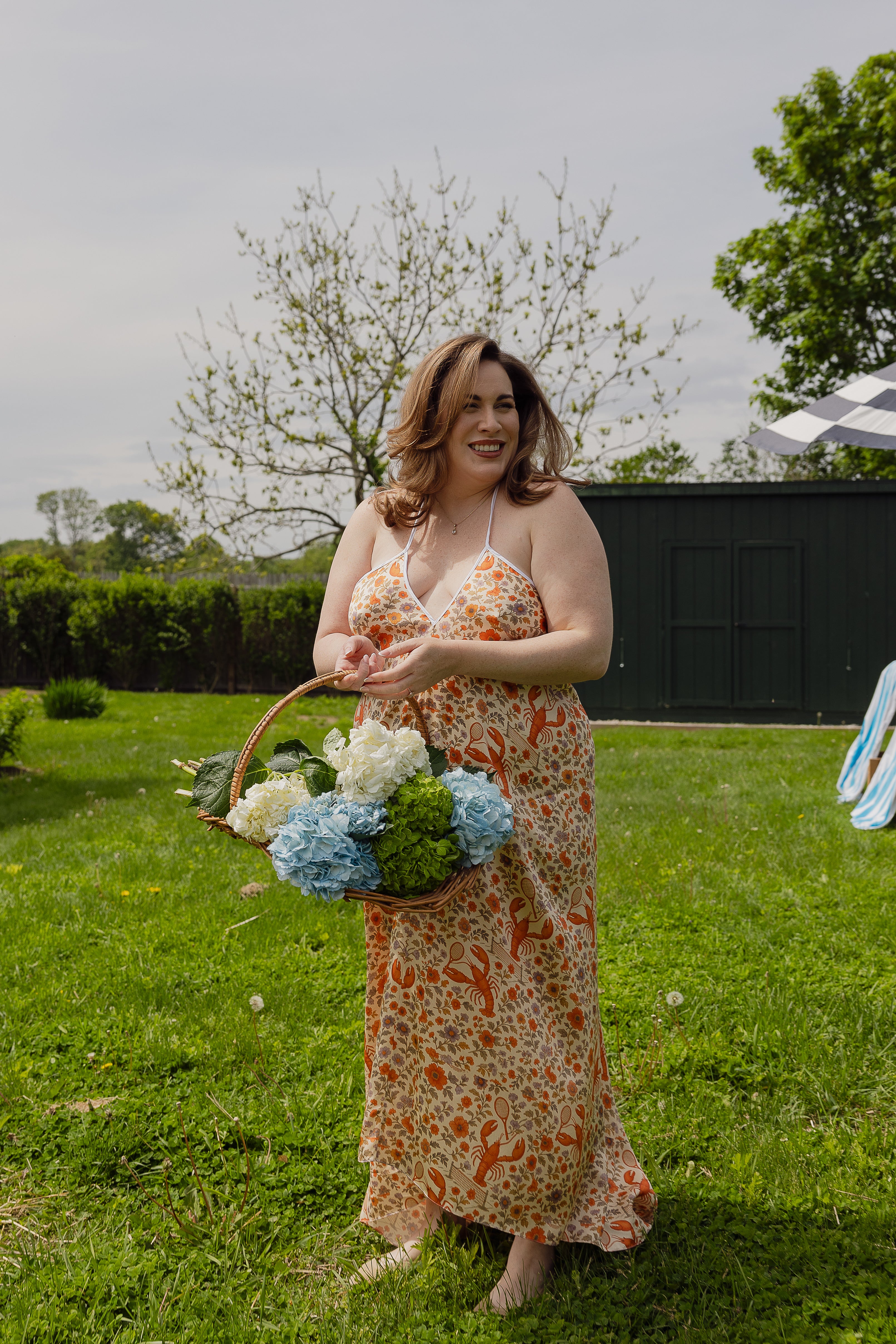 The Lobster Serve Dress in 100% silk with a tennis print, side profile