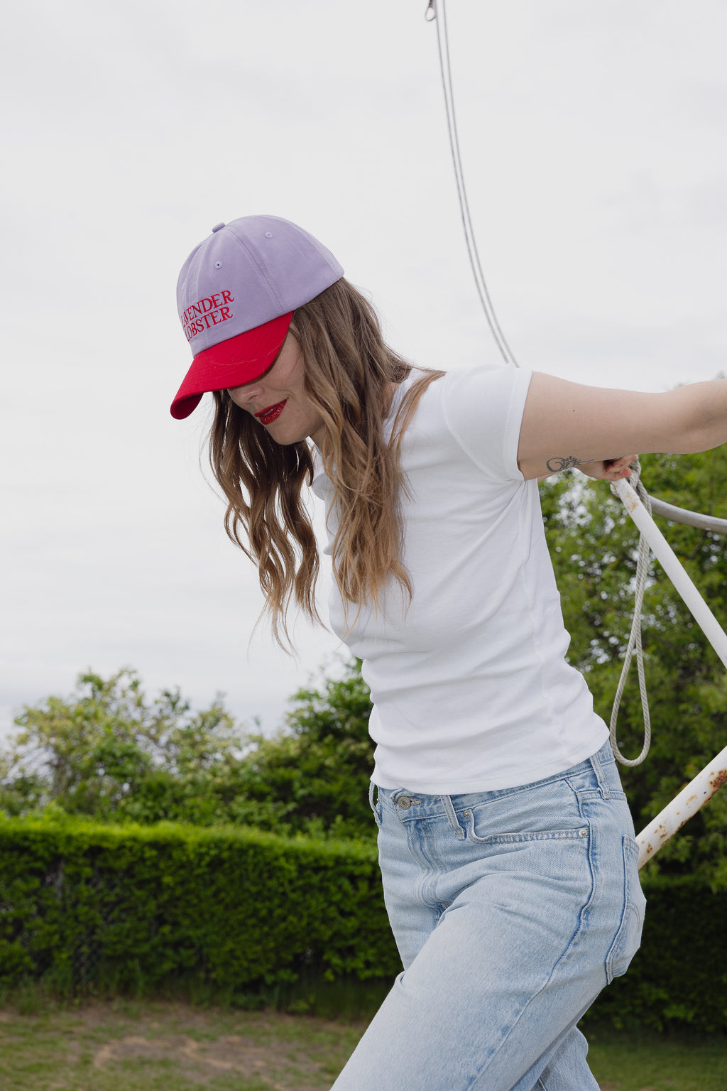 The Lobster Crew Cap in lavender and red 100% cotton, styled shot
