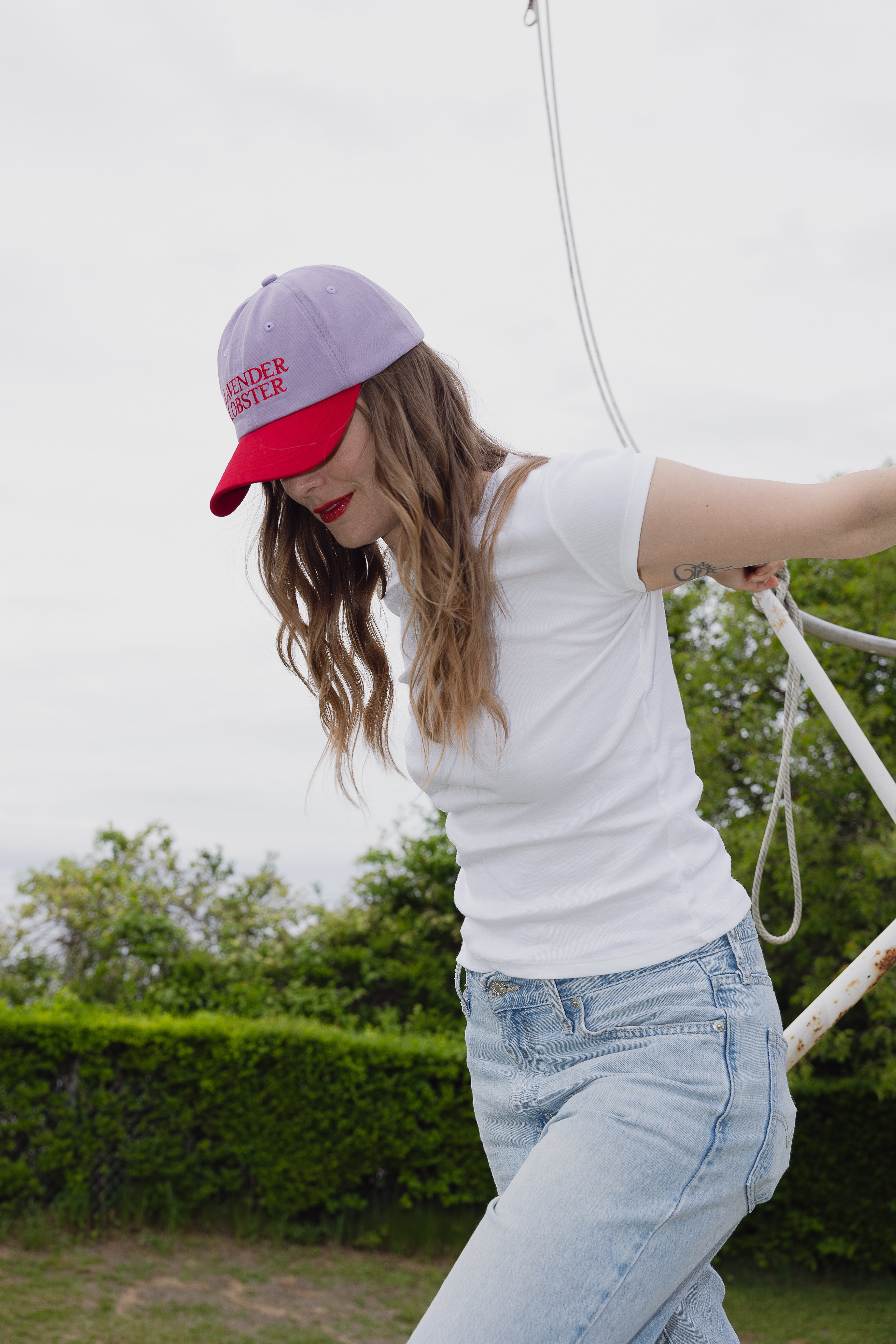 The Lobster Crew Cap in lavender and red 100% cotton, styled shot