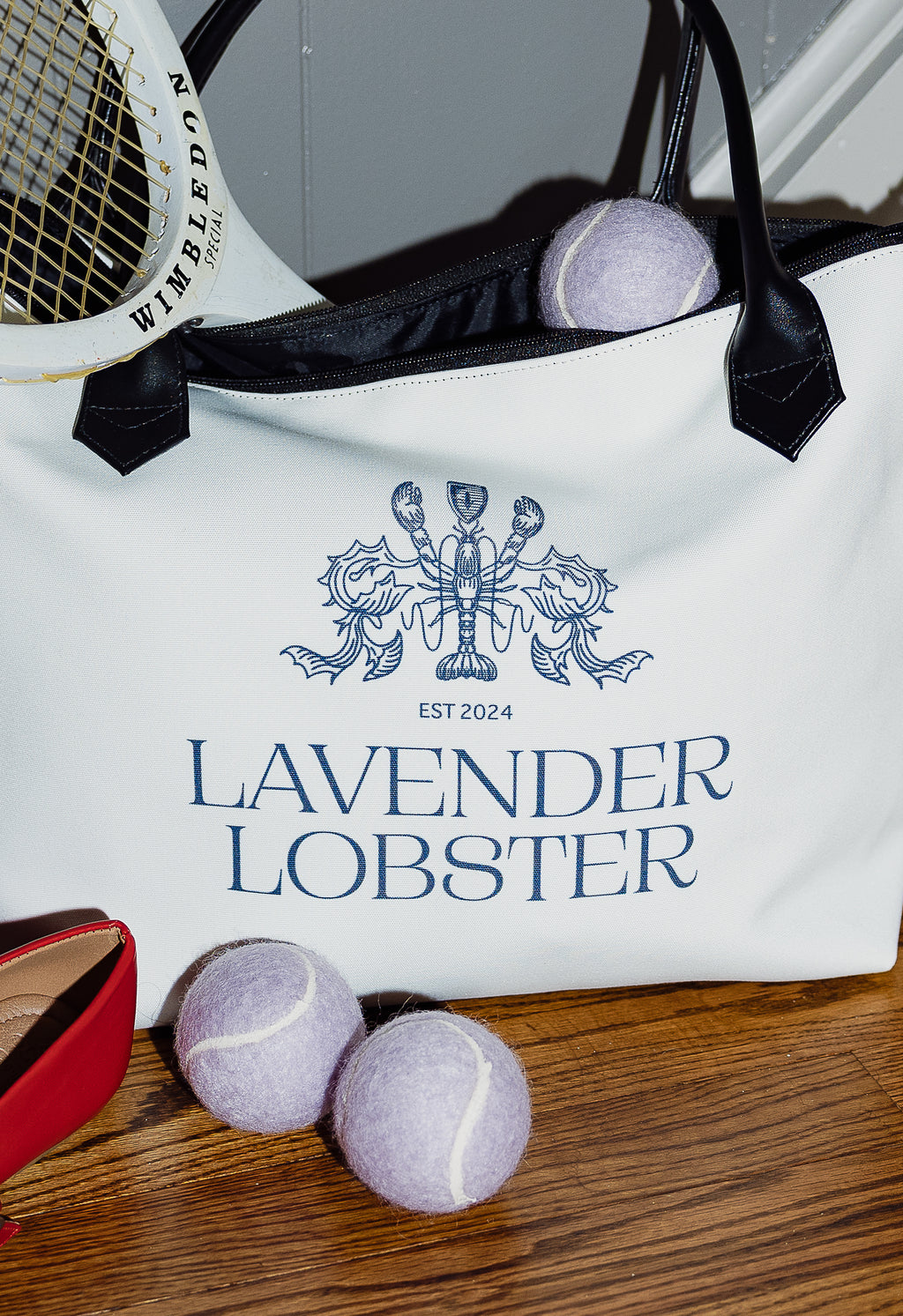 The Lobster Boat Tote in woven canvas with crest embroidery, detail view