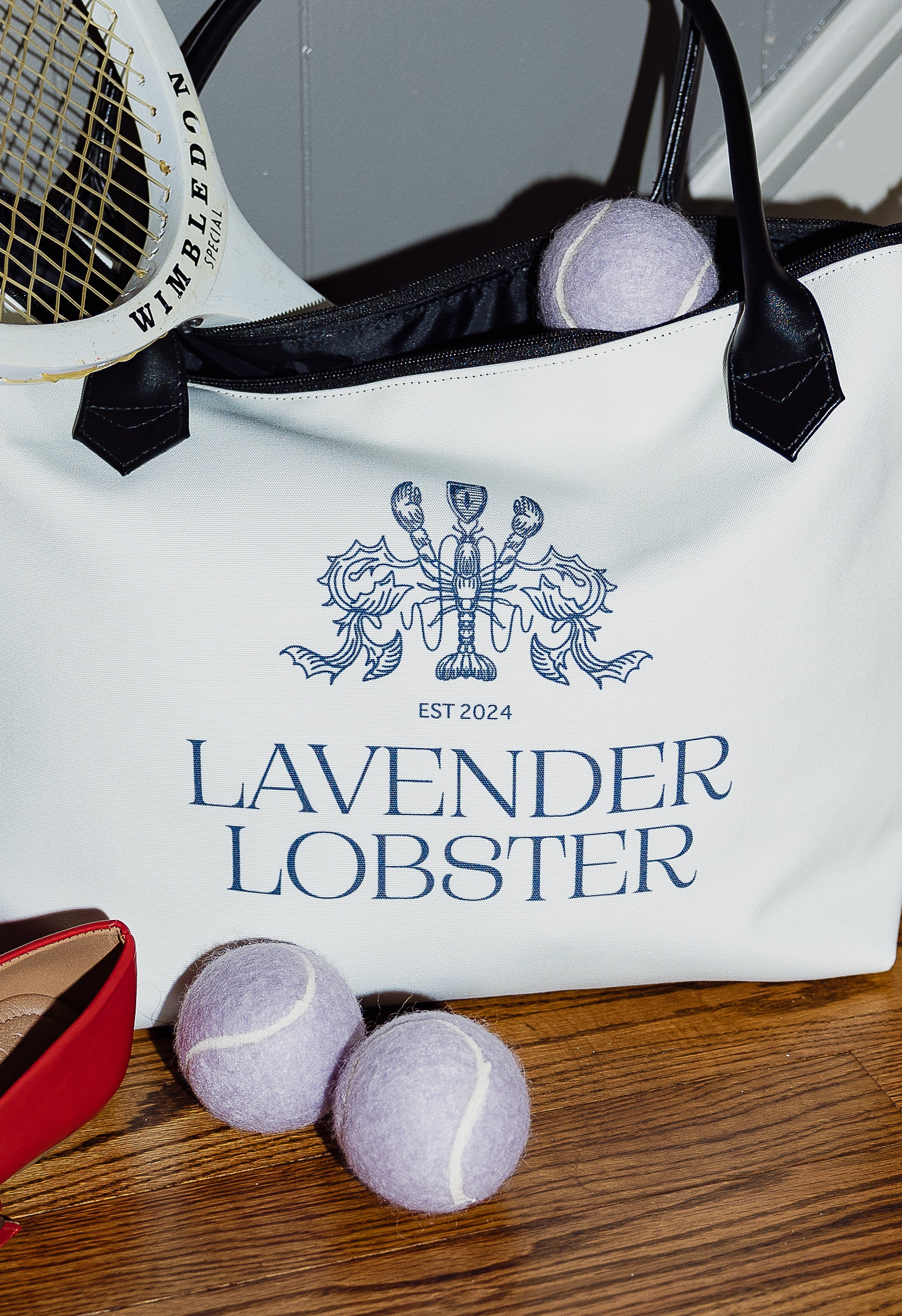 The Lobster Boat Tote in woven canvas with crest embroidery, detail view
