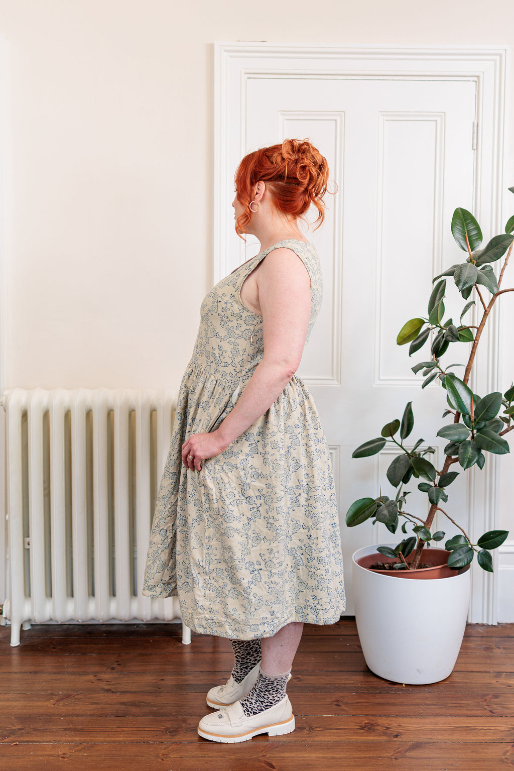 The Ledger Dress in hand block printed indigo floral kala cotton, worn outdoors