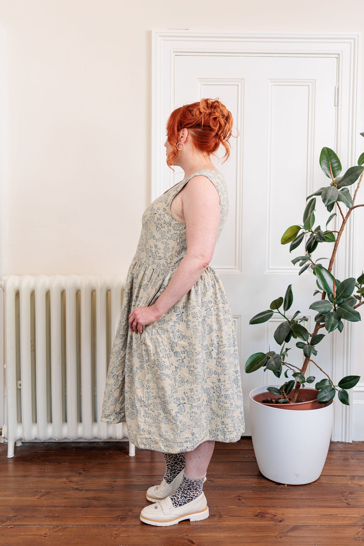 The Ledger Dress in hand block printed indigo floral kala cotton, worn outdoors