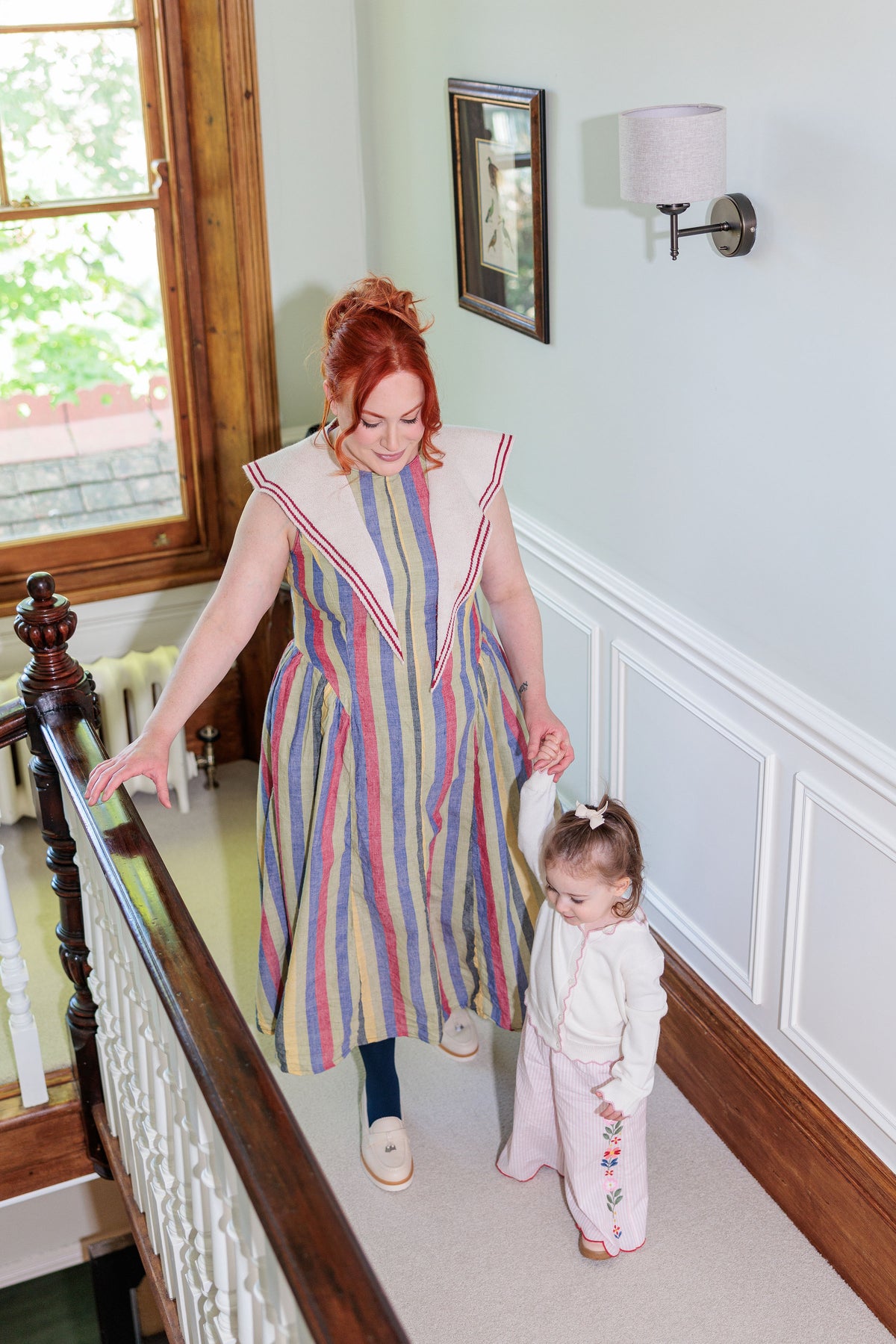 The Regatta Dress in handloomed cotton chambray stripe, worn outdoors