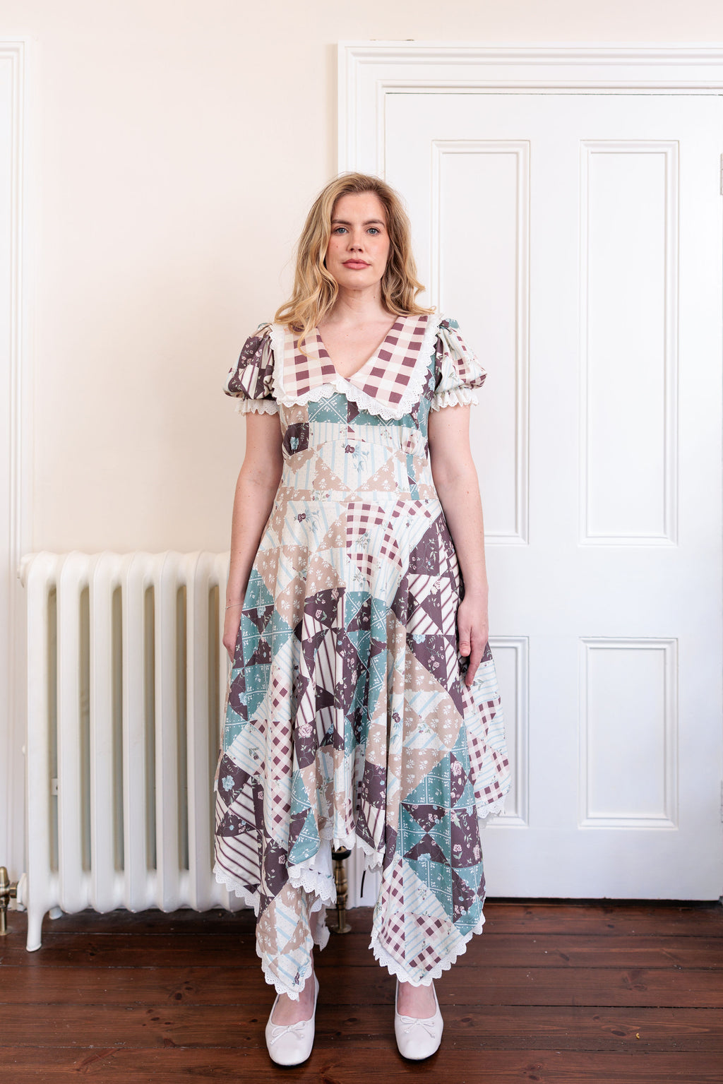 The Cottage Dress in organic cotton knit with a quilted countryside print and gingham collar, styled shot