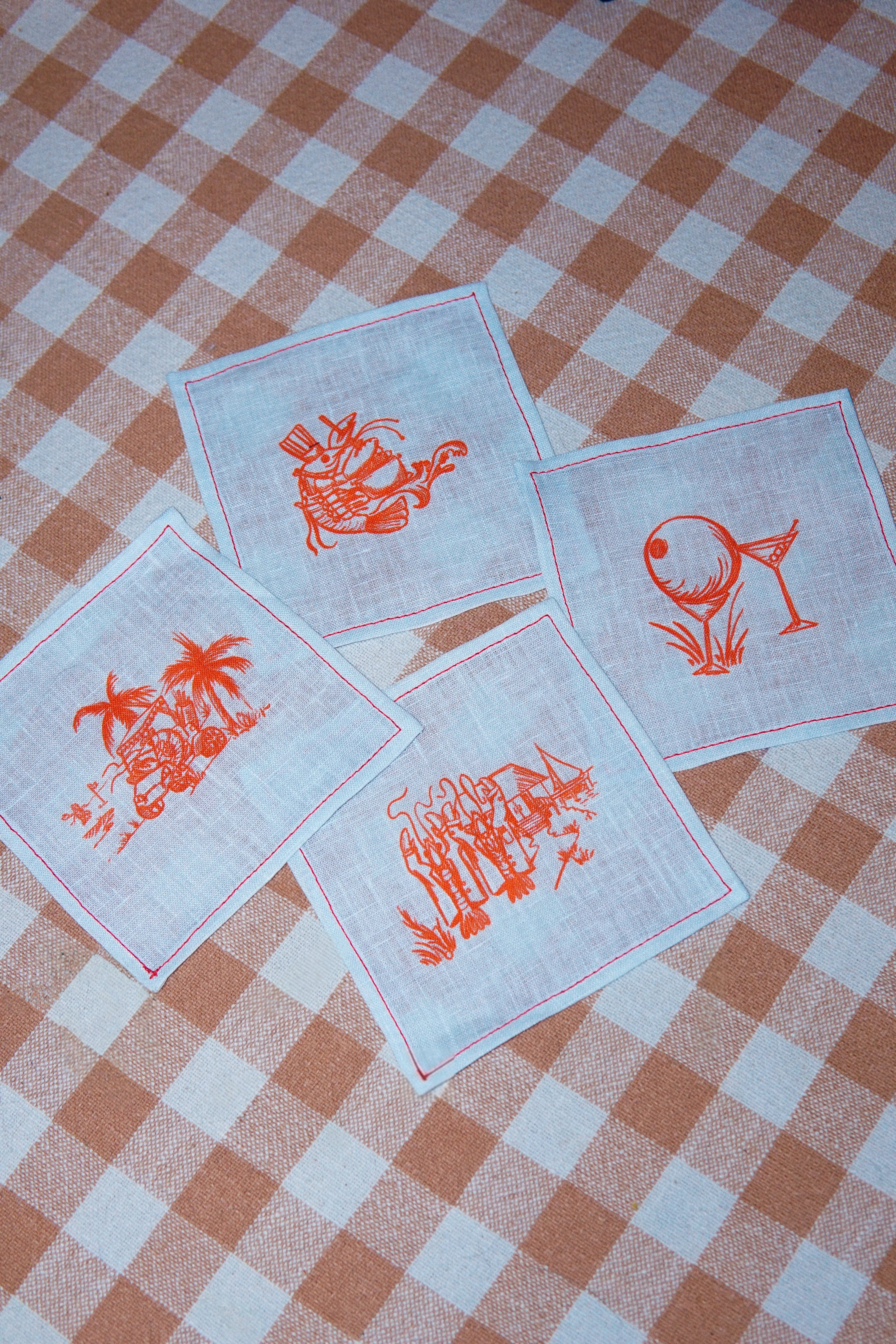 Clubhouse Cocktail Napkins, set of 4 in flax linen printed with yacht club scenes