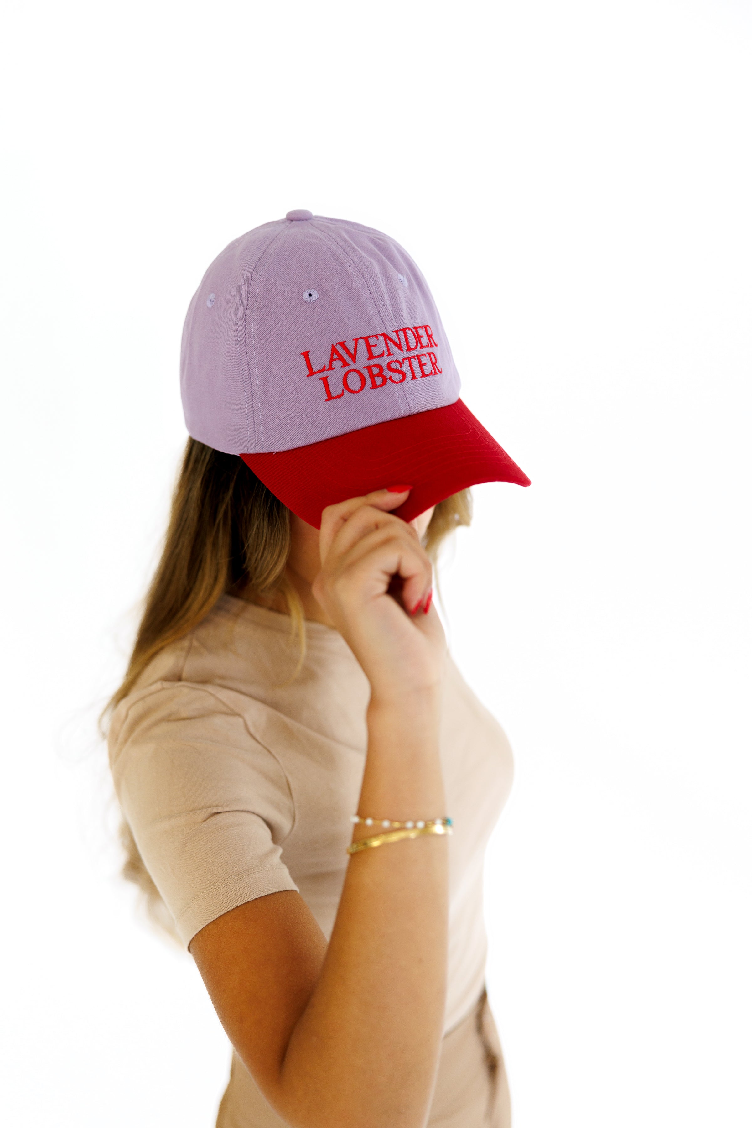 The Lobster Crew Cap in lavender and red 100% cotton, worn shot